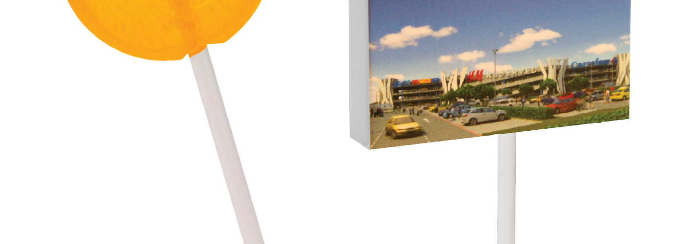 Placaté lízátko v reklamní krabičce