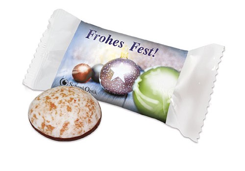 Perníček částečně politý čokoládou v obalu s potiskem