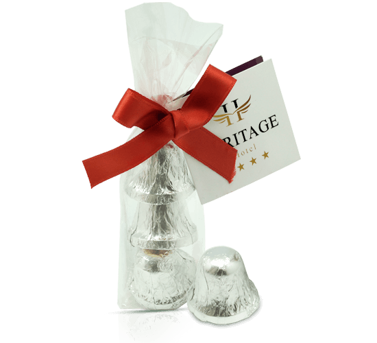 Ribbon bag with three chocolates in bell shape