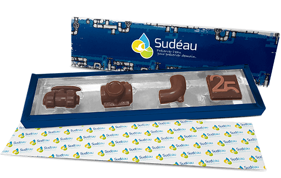 Lined carton box filled with custom made chocolate pieces