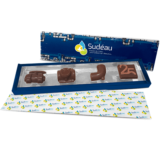 Lined carton box filled with custom made chocolate pieces